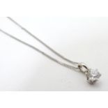 An 18ct white gold pendant set with brilliant cut 0.50ct diamond, with 18” white gold chain.