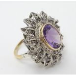 An impressive 18ct gold cocktail ring set with large central oval amethyst approx 6.