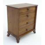 A mid 20 thC Victorian style apprentice piece miniature chest of drawers,