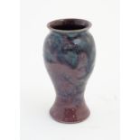A Baron Barnstaple pottery vase, with a high fired glaze. Marked under. Approx 5 1/4" high.
