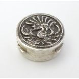A Continental white metal pill box of circular form 1 1/4" diameter CONDITION: