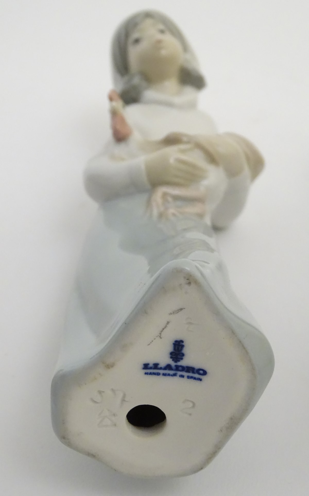 A quantity of Lladro and Nao figures, to include two Lladro penguins and girl holding a chicken, - Image 9 of 11