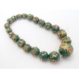 21 graduated Venetian glass beads with hand painted decoration.