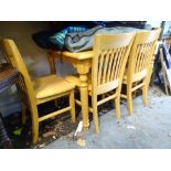 A satin finished pine kitchen table and 4 matching chairs CONDITION: Please Note -