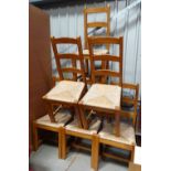 6 ladder back, rush seated modern dining chairs.
