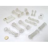 Knife / Spoon rests : 14 assorted shaped glass rests , the largest measuring 4 1/4" wide .