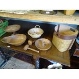 A rattan and leather basket, together with carved wooden bowls etc.