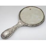 An embossed white metal ladies hand mirror CONDITION: Please Note - we do not make