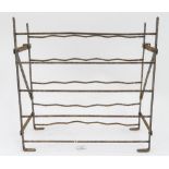 A cast iron wine rack CONDITION: Please Note - we do not make reference to the