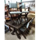 A dark stained oak dining table,