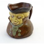 A Victorian Toby jug with a tricorn hat and a cravat. Approx. 4 3/4" high.
