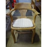An early 20thC stripped oak Carver chair CONDITION: Please Note - we do not make