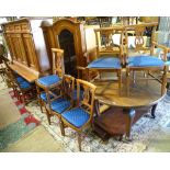 A large dining room suite, comprising a dining table with 10 chairs, a sideboard,