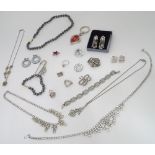 A quantity of costume jewellery, to include brooches, necklaces etc.