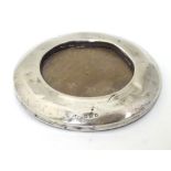 A silver photo frame of circular form hallmarked London 1919 3" diameter overall