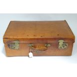 An early to mid 20thC pigskin leather suitcase with brass fitments CONDITION: Please