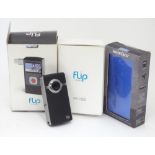 A boxed flip video digital camera,