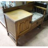 A mid 20thC oak telephone table,