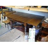 An oak drawer leaf dining table with barley twist columns CONDITION: Please Note -