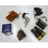 A quantity of assorted items to include WW1 binoculars, a Bakelite pencil sharpener, Roberts radio,