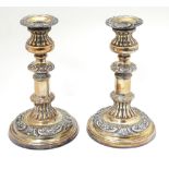 A pair of Old Sheffield plate candlesticks approx 8 1/2" high CONDITION: Please