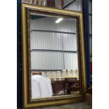 A modern gilt framed mirror with bevelled glass CONDITION: Please Note - we do not