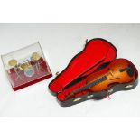 A miniature case violin,