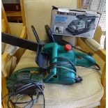 An assortment of electric tools, to include an electric Bosch chainsaw,
