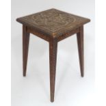 A small oak stool with carved fruiting vine decoration CONDITION: Please Note - we