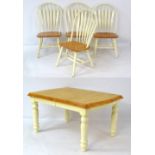 A 21stC dining table and four matching chairs,