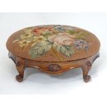 A Victorian walnut footstool,