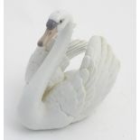 A 20thC Lladro figure of a swan, no. 5231, printed and impressed marks to base. Approx.
