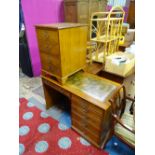 An oak veneered and leather topped office desk with a pull out section for a keyboard,