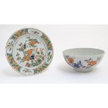 A Chinese Famille Rose plate decorated with flowers, birds and fish,