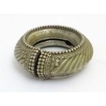 A large white metal torque / silver bangle / arm bangle (arm bracelet) probably Anglo-Indian,