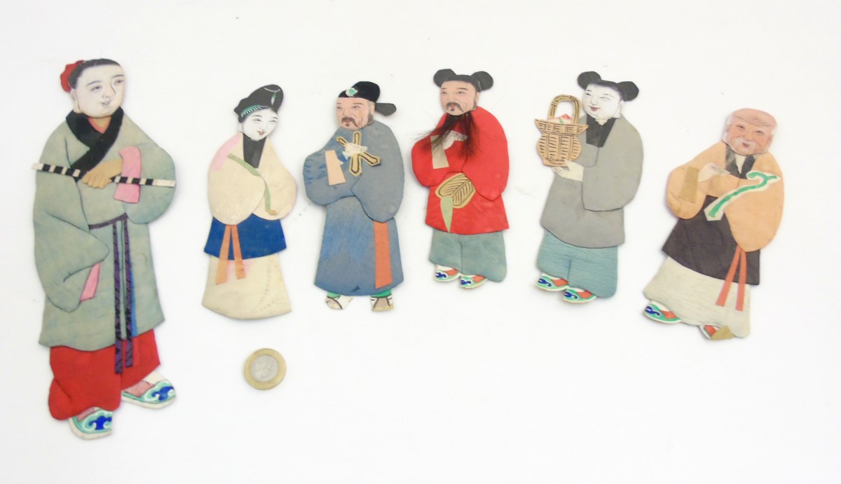 Chinese silk decorated applique figures with penwork faces.