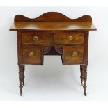 A mid / late 19thC mahogany lowboy with a bow fronted top above one long drawer and two short