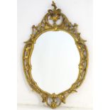 A Chippendale style giltwood mirror.