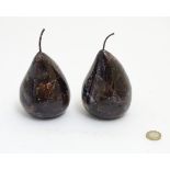 A pair of purple glass pear shaped items, each approximately 5 1/2” (including stalks).