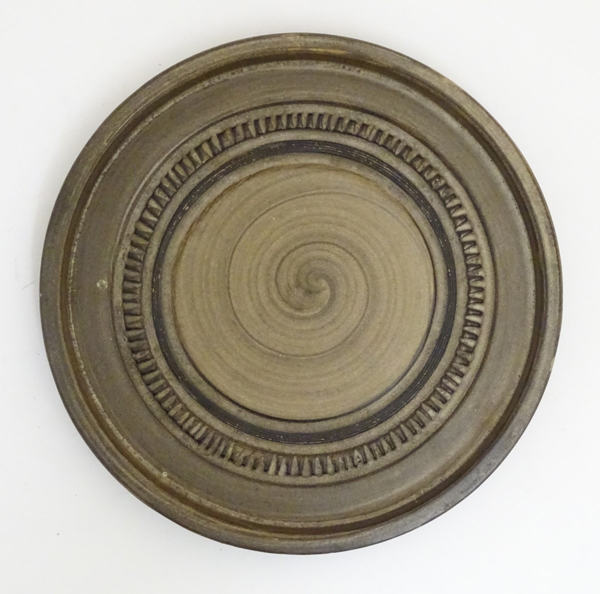Scandinavian Studio Pottery: mid 20thC A brown Swedish plate by Yourstone,