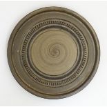 Scandinavian Studio Pottery: mid 20thC A brown Swedish plate by Yourstone,