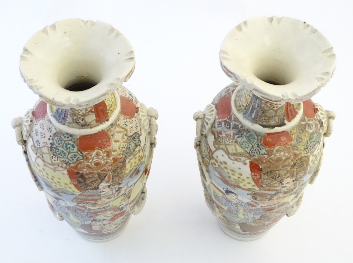 A pair of Japanese Satsuma vases, decorated with figures in a lavish interior, - Image 7 of 7