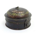 A 19thC toleware tin spice box of circular form with domed cover, remains of Japanned finish,