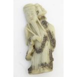 A Chinese carved jade figure of an oriental deity 6" high CONDITION: Please Note -