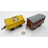 Hornby O gauge: two railway trucks, an LMS cattle truck and a Portland cement blue circle wagon,