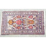 Carpet / Rug : a hand woven rug with central light buff ground,