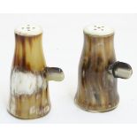Pair of horn cruets with side twist decoration, the tallest 4” high.