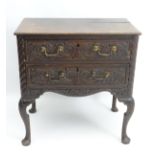 An early 18thC oak lowboy,