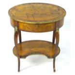 A 19thC French centre table with an oval top and brass mounts,