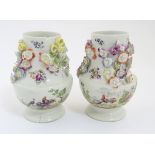 Two rare mid 18thC Derby flower encrusted vases of pear shape,